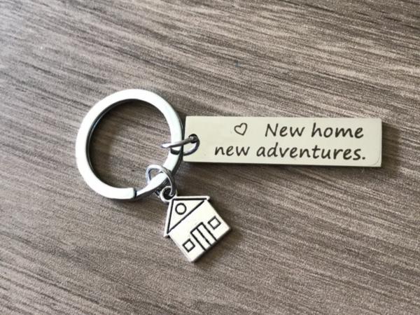 Tas / sleutelhanger 'New home new adventures'